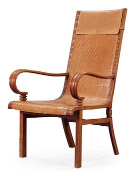 A Hjalmar Jackson pear wood and brown leather easy chair, Stockholm 1934,