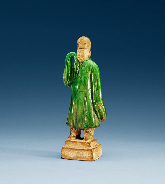 A green glazed figure of a man, Ming dynasty.