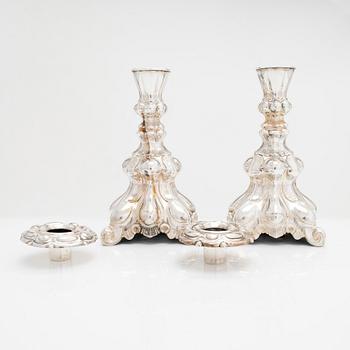 A mid-20th century silver candelabra and two candlesticks.