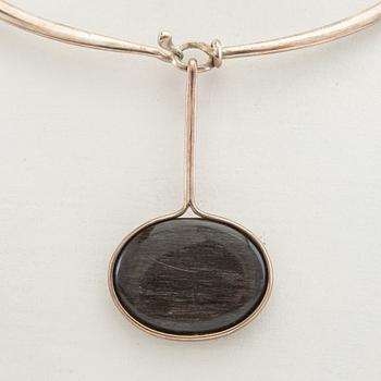 Vivianna Torun Bülow-Hübe, Necklace with pendant and a pair of earrings by Georg Jensen, Denmark, sterling silver and stone.