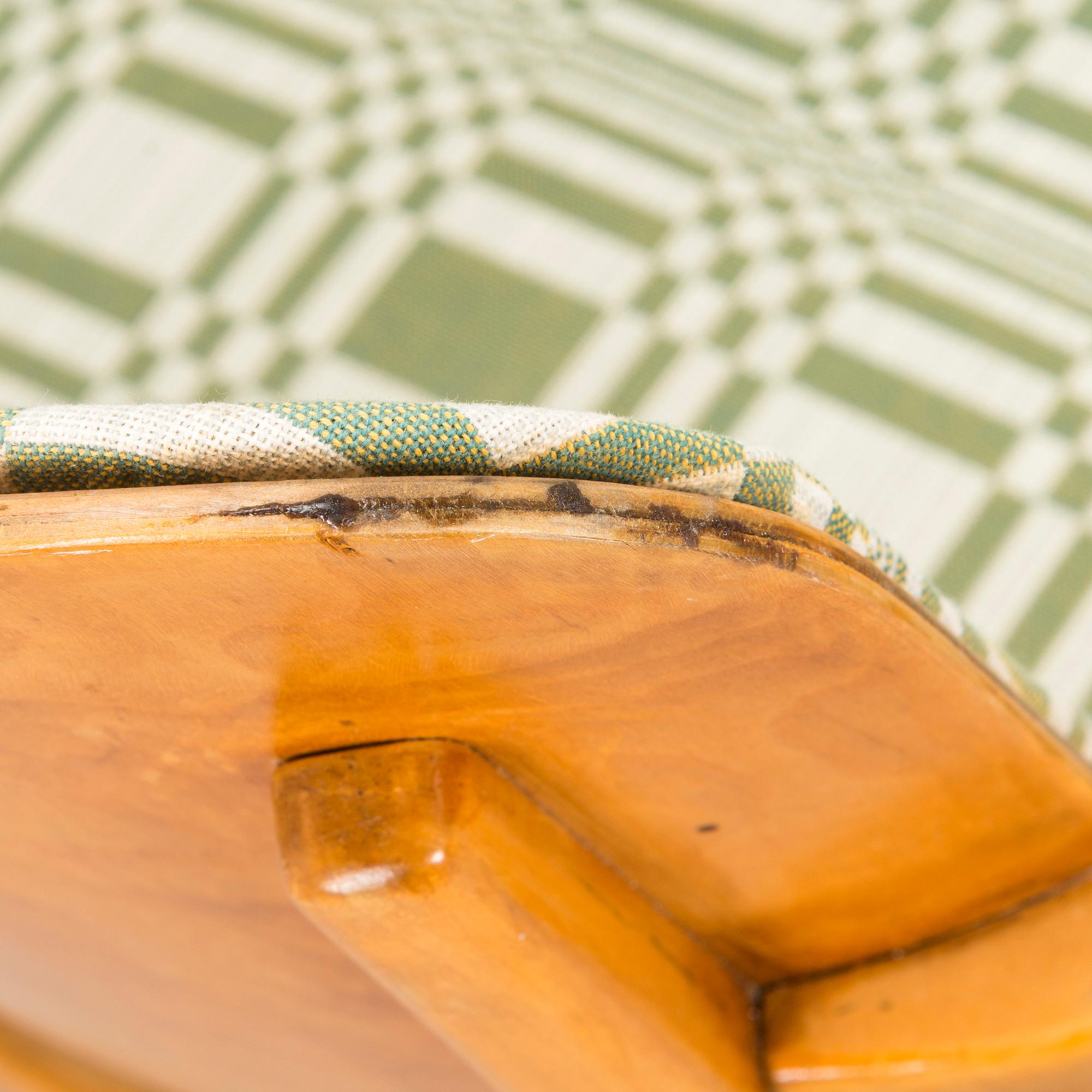 A mid-20th century armchair upholstered with fabric by Johanna Gullichsen.