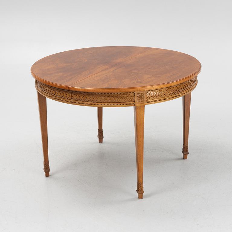 A Dining Table and Twelve Chairs, late Gustavian style, 20th Century.