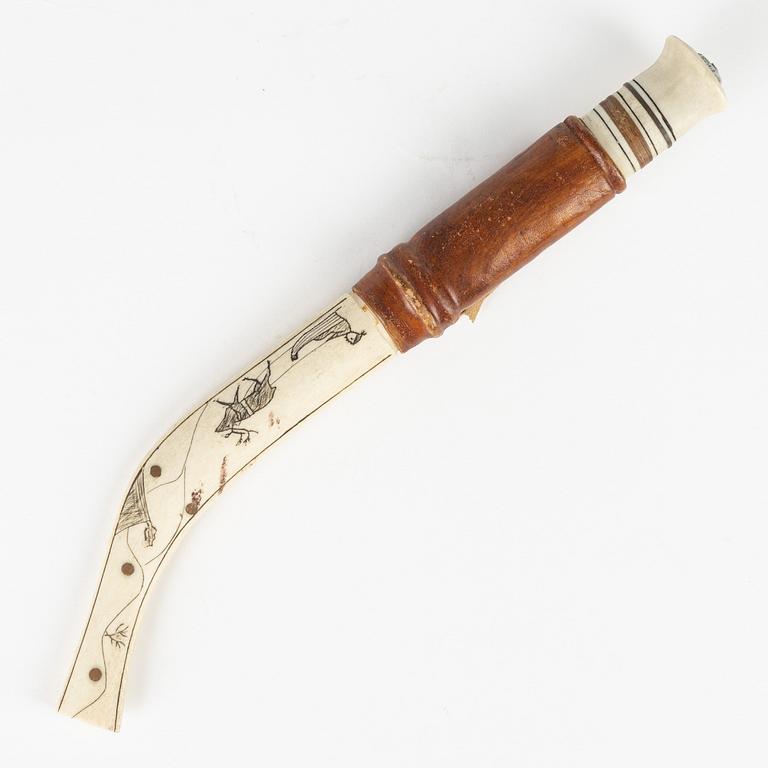 A reindeer horn knife, signed AL.