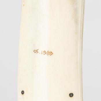 A reindeer horn knife by Olav Svonni, signed and dated 1989.