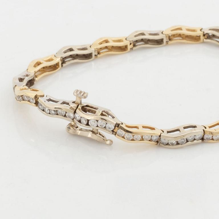 14K gold and brilliant cut diamond bracelet, with extra link.