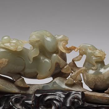 A Chinese nephrite sculpture of three rams.