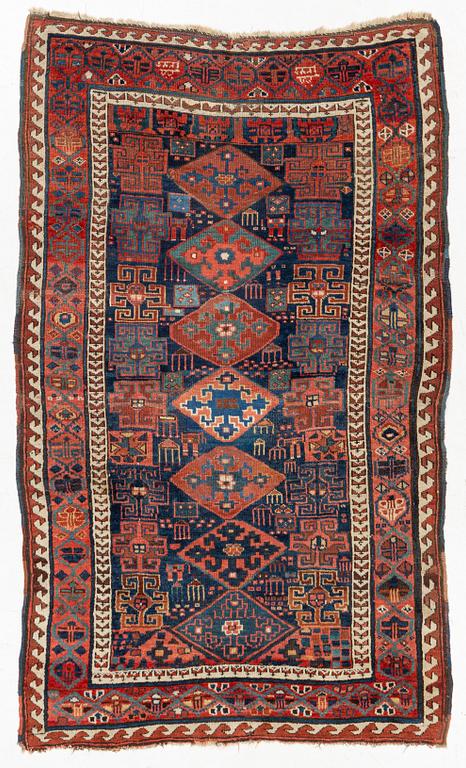 An antique Kurdish / Turkish carpet by the Herki Tribe, c 233 x 137 cm.