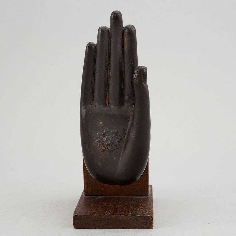 A bronze scultpure of a hand gesture, Thailand, 20th Century.