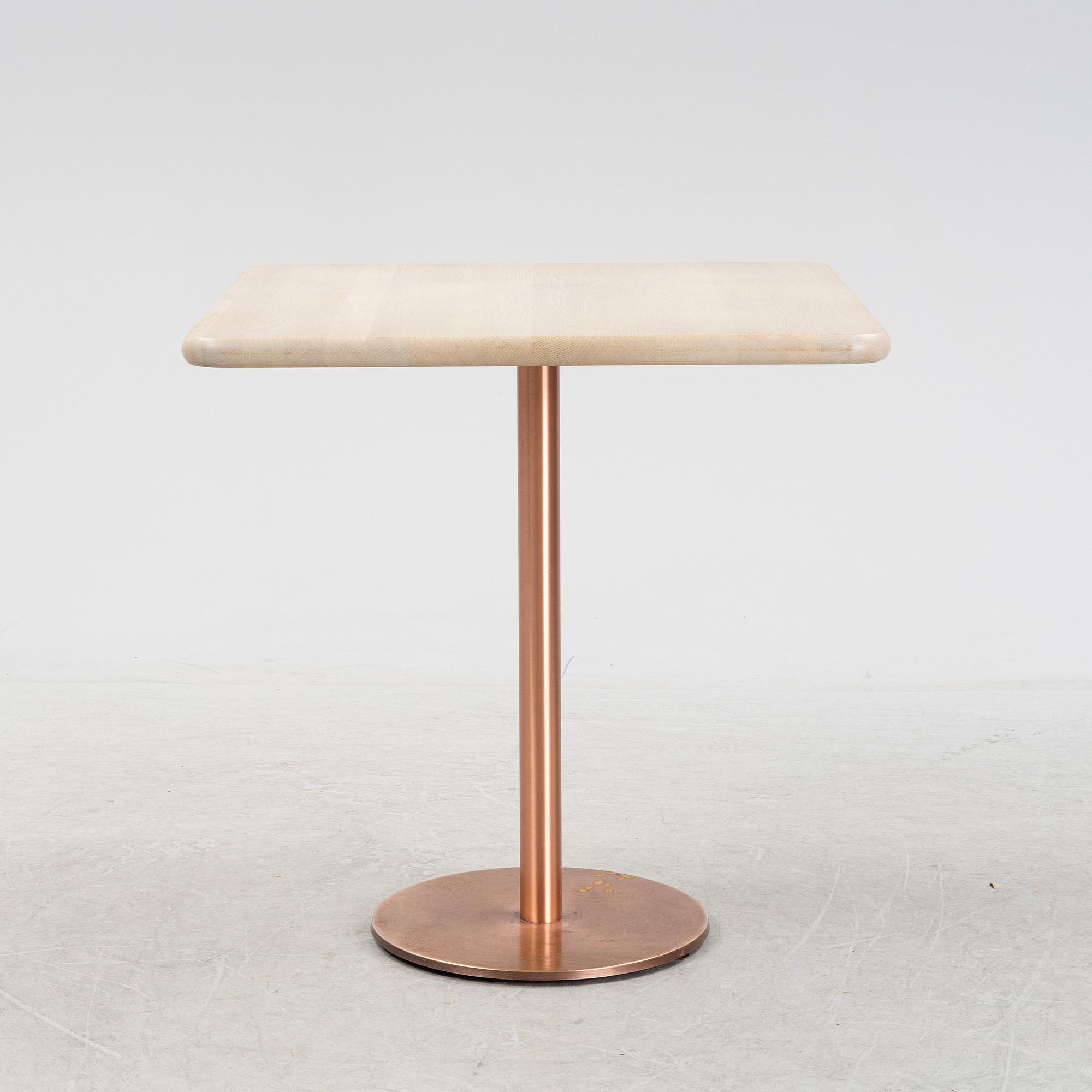 A steel and oak table by Jonas Lindvall Stolab, 2011.