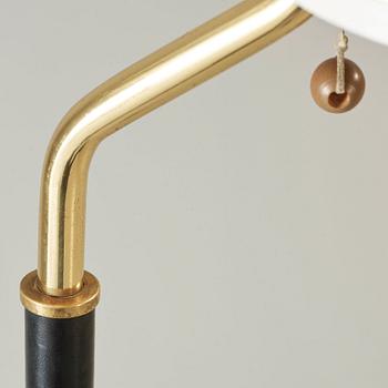 An Alvar Aalto 'A 808' brass and black leather floor lamp, Valaisinpaja, Finland late 1970's.