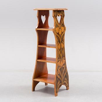 An early 20th century art nouveau shelf.