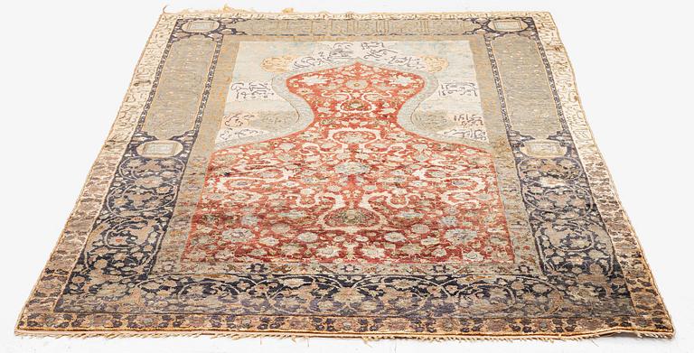 An antique silk rug, probably Istanbul, Turkey, c. 181 x 127 cm.