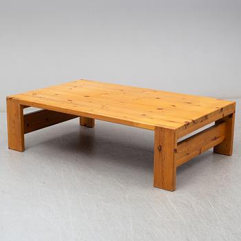 A 1960s pine coffee table.