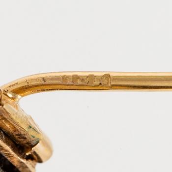 A brooch/pendant, gold and silver with topaz and old-cut diamonds, circa 1900.