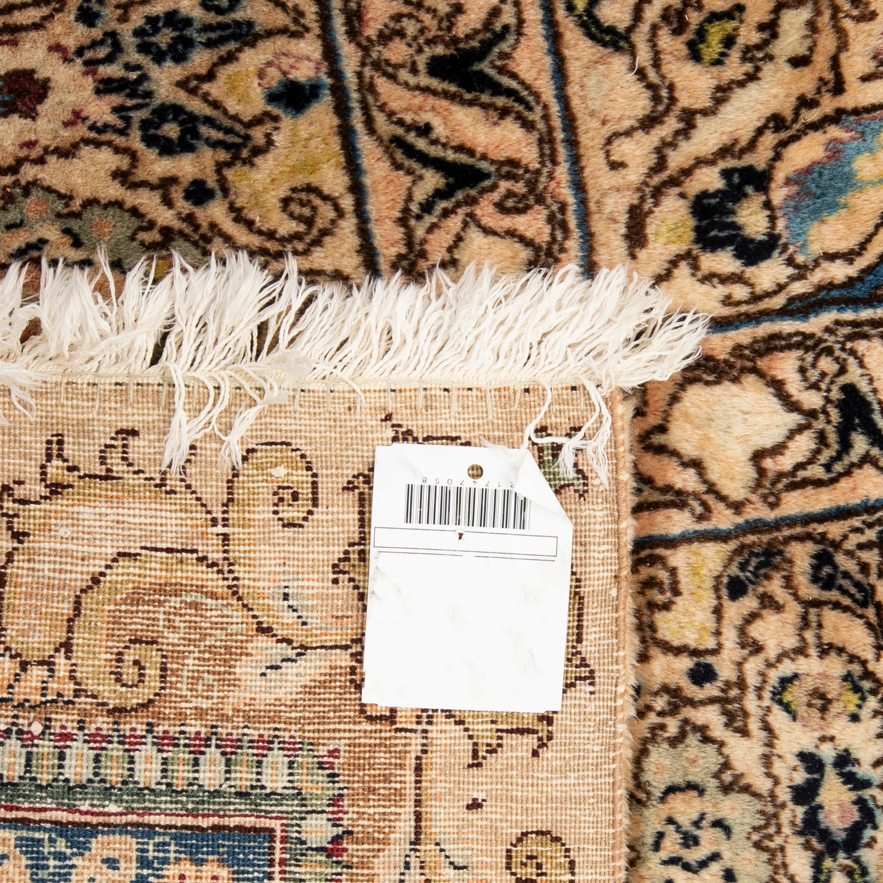 An antique Tabriz carpet, North West Persia, signed Akhondzadeh, c. 394 x 295 cm.