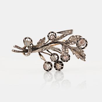 A BROOCH set with rose-cut diamonds.