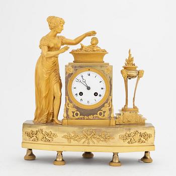 A French Empire gilt bronze mantle clock, early 20th Century.