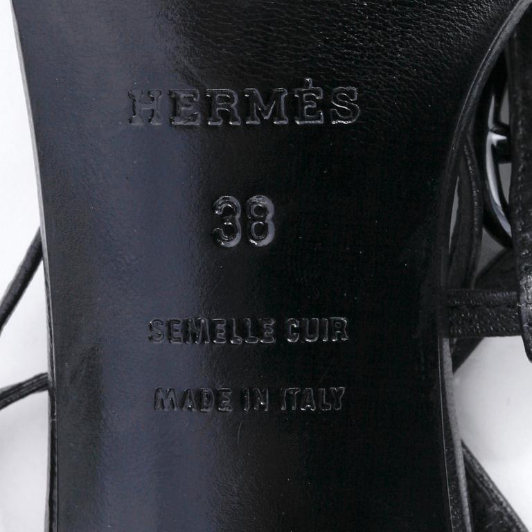 HERMÈS, a pair of black leather sandals. Size 38.