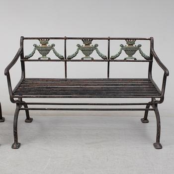 GARDEN SOFAS, a pair, cast iron, empire style, late 19th century.