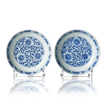 1043. A pair of blue and white 'lotus' dishes, Qing dynasty, Tongzhi mark and of the period period (1862-74).