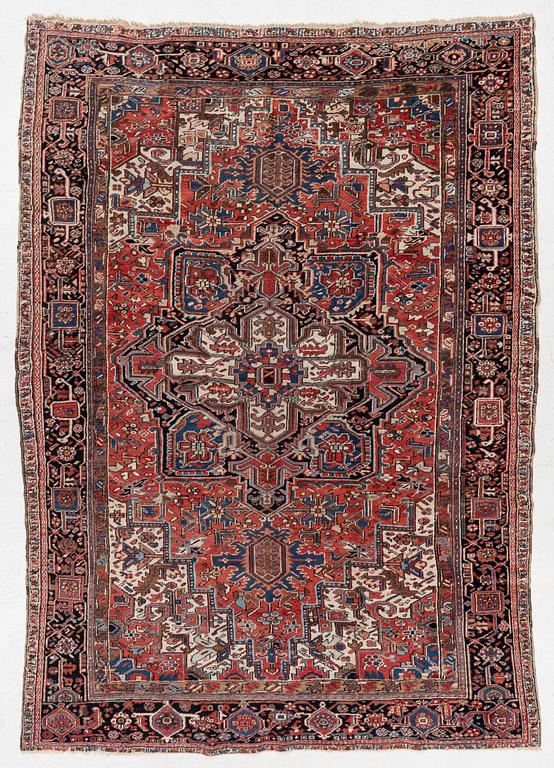 An antique Heriz carpet, west Persia, c. 333 x 238 cm.