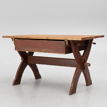 A Swedish folk-art trestle table from Dalarna, dated 1854.
