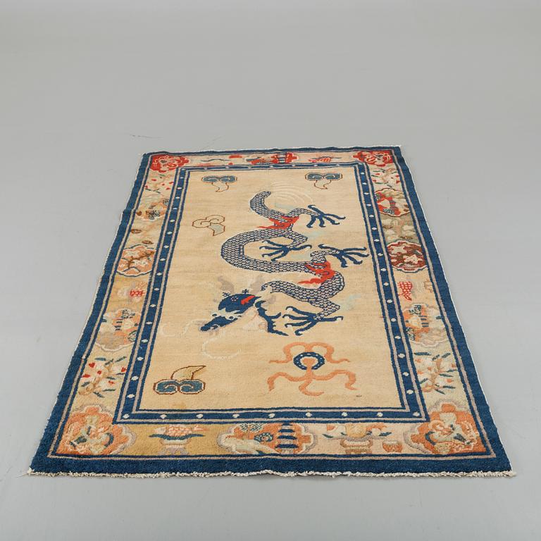 A semiantique Chinese Baotou carpet ca 206 x 118 cm.