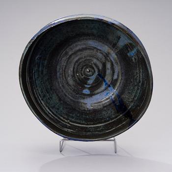 A ceramic bowl signed AMO.