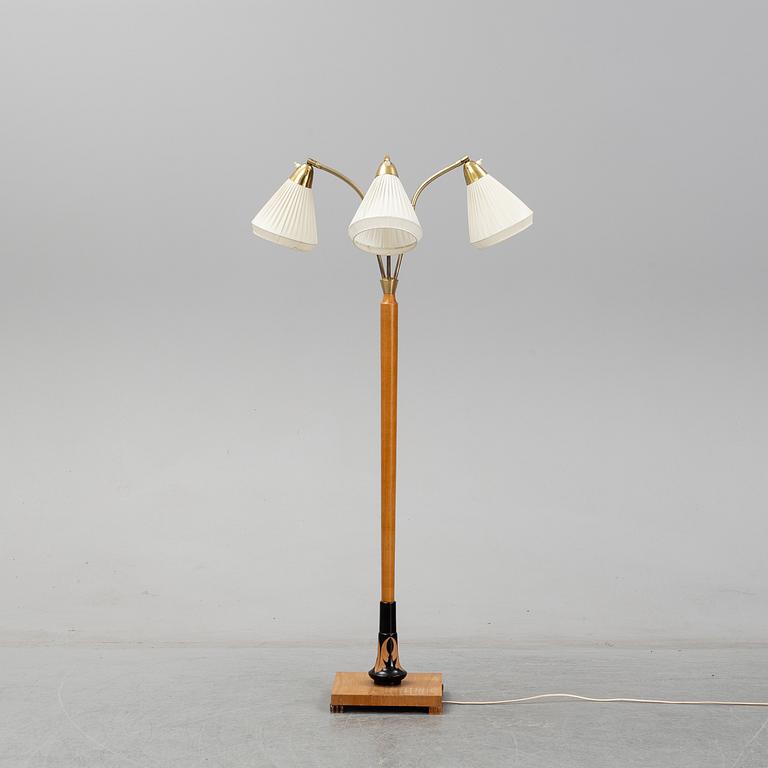 An elm floor light, mid 20th Century.