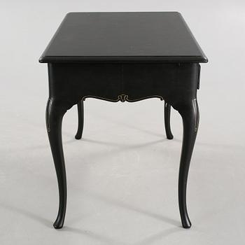 A 20th century desk in the style of rococo.