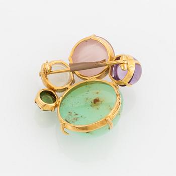 Brosch, guld med  cabochonslipade färgstenar.
