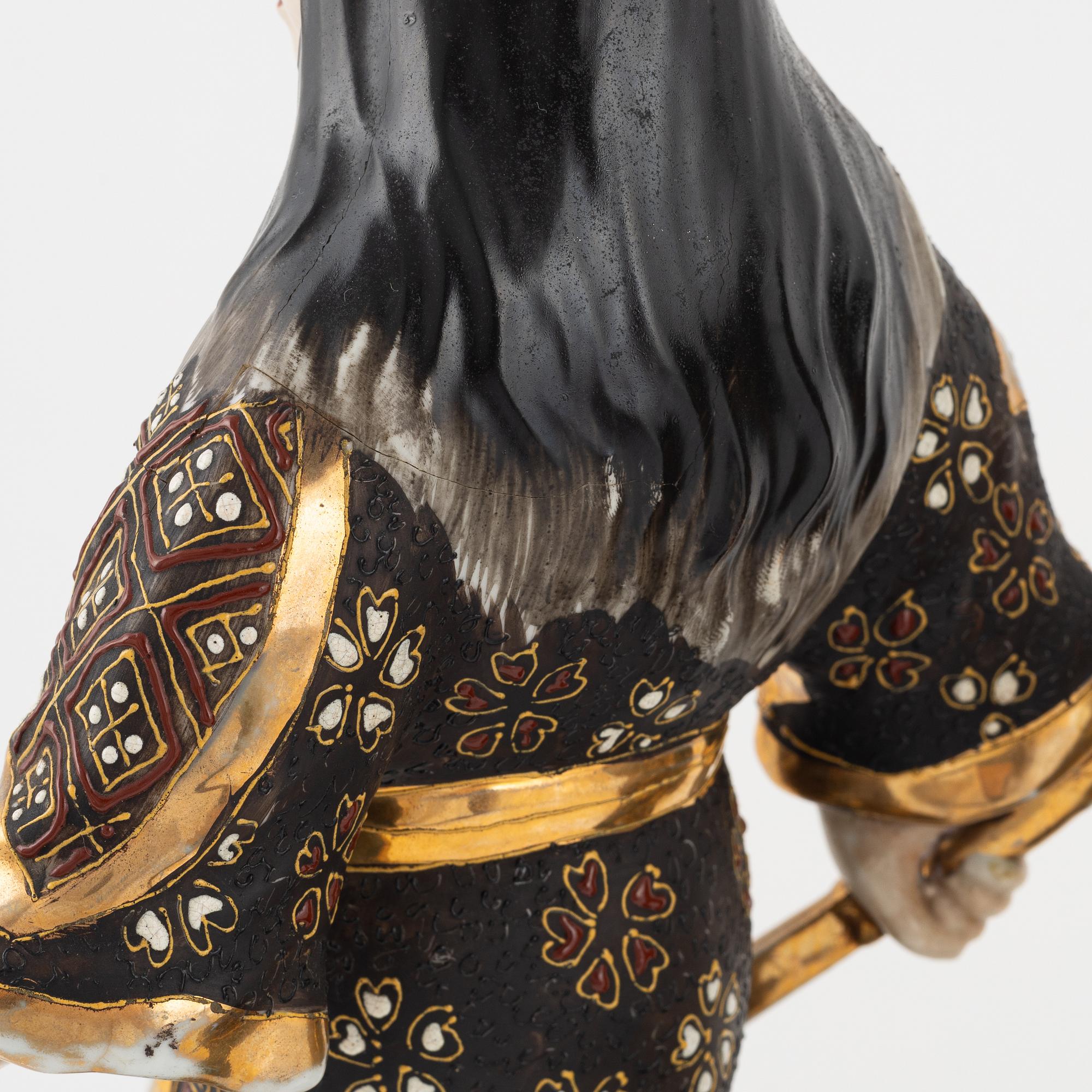 A pair of Japanese porcelain figurines, 20th century,