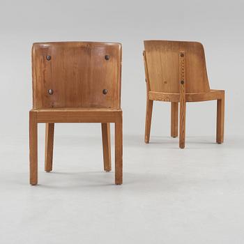 A pair of Axel Einar Hjorth 'Lovö' stained pine armchairs, Nordiska Kompaniet, Sweden 1930's.