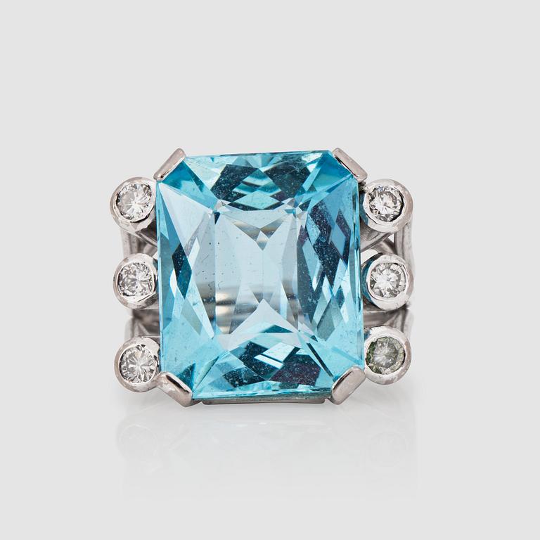 An aquamarine and brilliant-cut diamond ring.