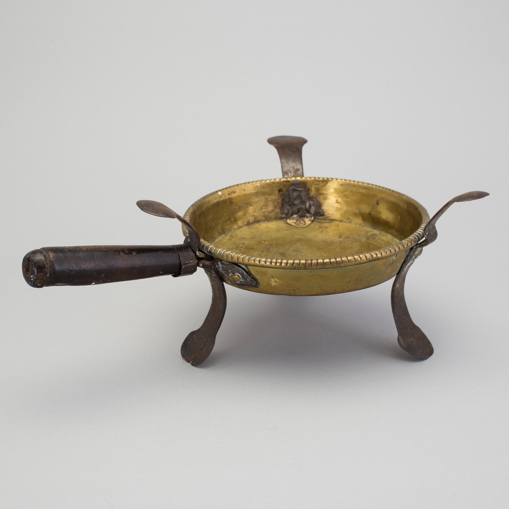 An 18th century brass brazier.