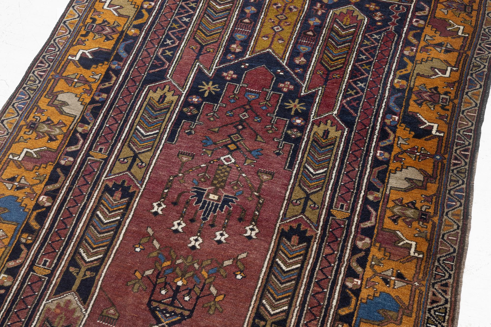 An Anatolian prayer rug, semi-antique, c. 205 x 115 cm.