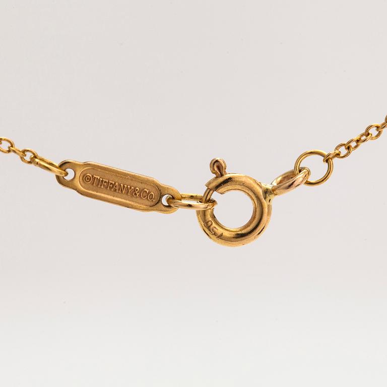 Tiffany & Co, an 18K gold necklace with a diamond ca. 0.17 ct.