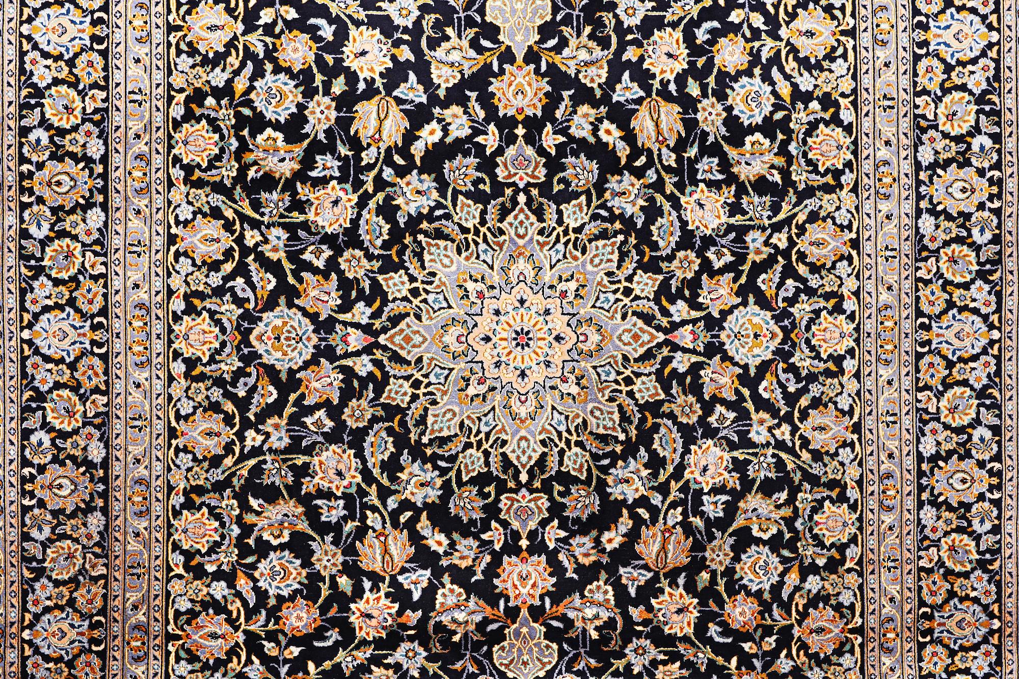A Kashan carpet, signed, c. 410 x 270 cm.