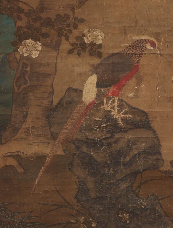 A hanging scroll of birds and magnolia in a garden, Qing dynasty.