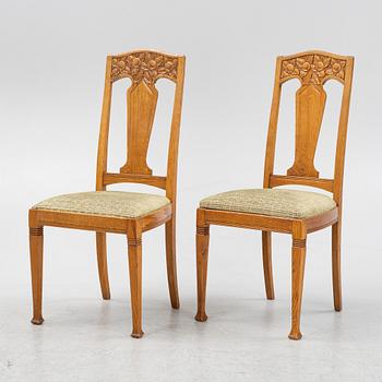 A set of six oak chairs, around the year 1900.
