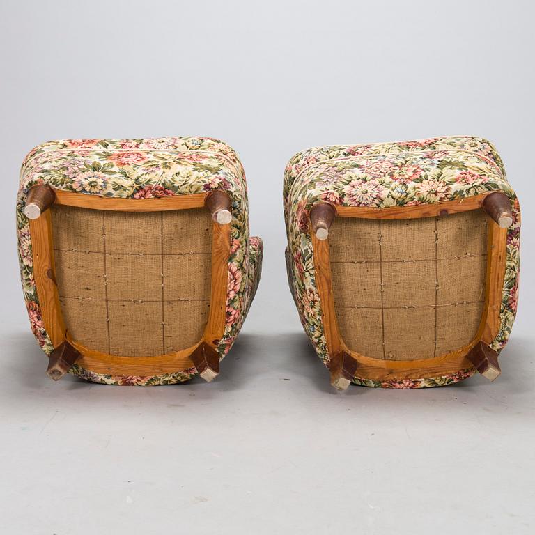 A pair of mid-20th-century armchairs.