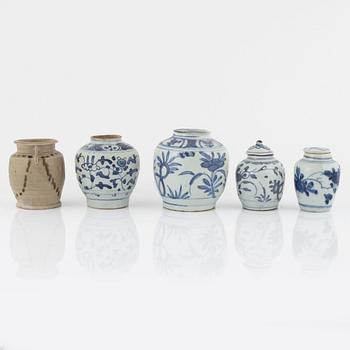 Five blue and white porcelain and ceramic urns, Ming dynasty, (1368-1644).