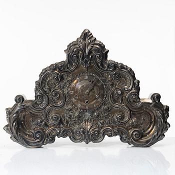 A part silver Rococo-style mantle clock, Portugal/South America, circa 1900.