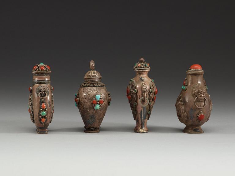 A set of four Tibetan snuff bottles with stoppers, ca 1900.
