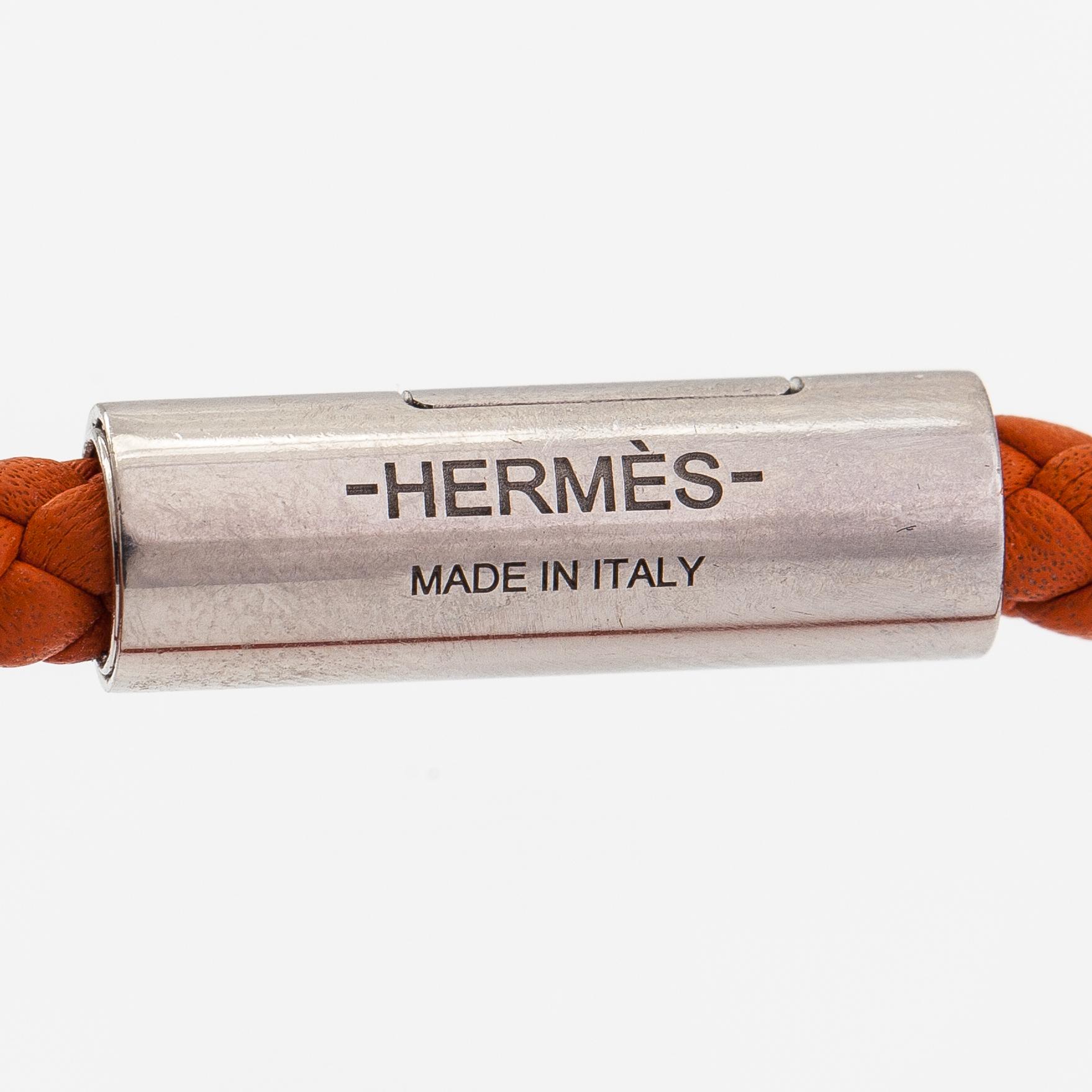 Hermès, A leather and metal bracelet. Marked Hermès Made in Italy.