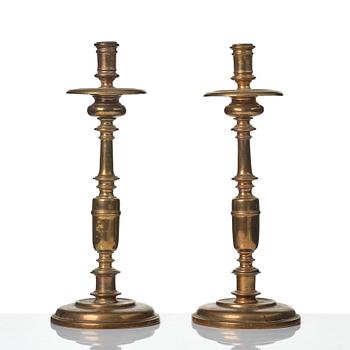 A pair of baroque brass candlesticks, 18th century.