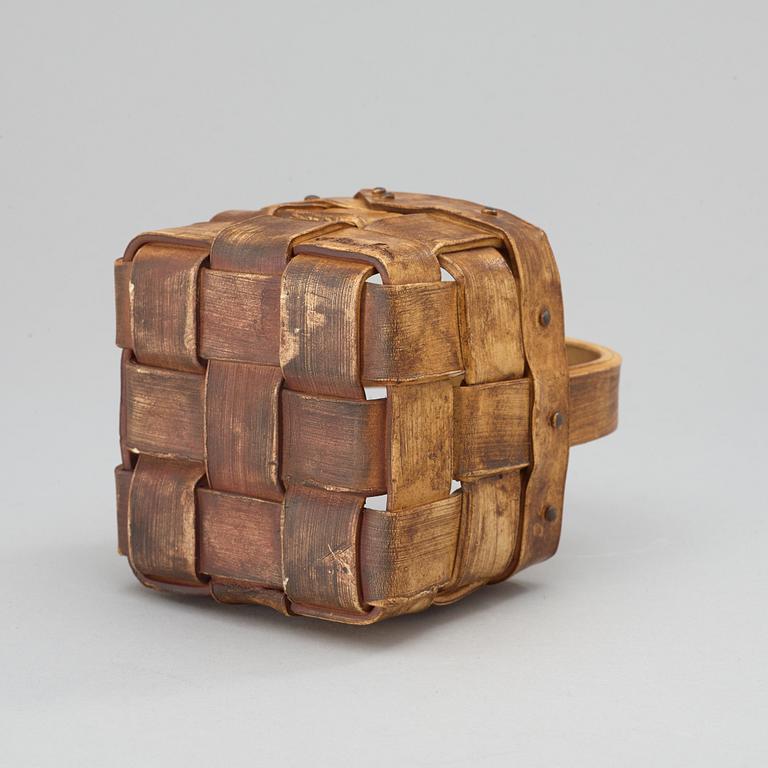 An Ingrid Herrlin stoneware blueberry basket with two lingonberries, Båstad, Sweden.