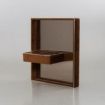 A 1970's bedroom mirror with vanity table.