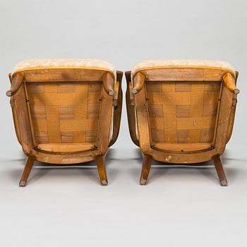 Einari Kyöstilä, a pair of 1940s open armchairs for Oy Stockmann Ab, Keravan Puusepäntehdas, Finland.