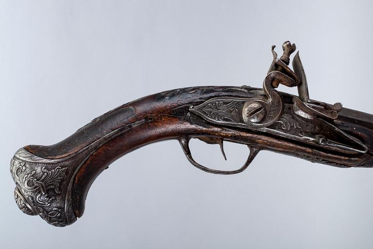 An 18th Century flinlock pistol.